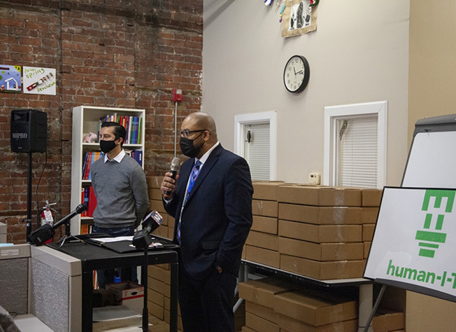 Sean de Four, President and CEO of Southwest Solutions, and Gabe Middleton, CEO of human-I-T, announce the donation of 100 laptops