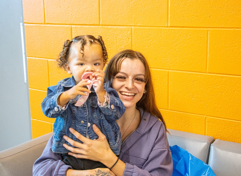 Woman with her child at Santa Day, a Children Youth and Family event. 